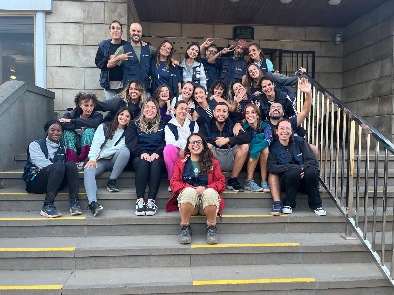 Alicia with a group on outdoor steps